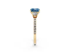 Fancy Blue Asscher Cut Diamond Three-Stone Ring Set in Yellow gold with Pavé Band and Graduated Sides