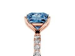 Fancy Blue Princess Cut Diamond Solitaire Engagement Ring Set in Rose gold with Round Pavé Band and Prong Setting