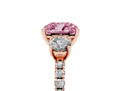 Fancy Pink Cushion Cut Diamond Three-Stone Ring Set in Rose gold with Pavé Band and Graduated Sides