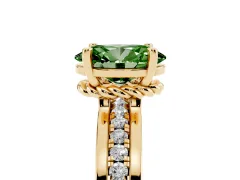 Fancy Green Oval Cut Diamond Solitaire Ring Set in Yellow gold with Channel Set Band and Prong Setting