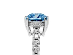 Fancy Blue Cushion Cut Diamond Solitaire Engagement Ring Set in Platinum with Pavé Band and Prong Setting