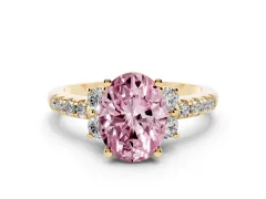 Fancy Pink Oval Cut Diamond Three-Stone Pavé Ring Set in Yellow gold with Prong Setting