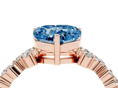 Fancy Blue Heart Cut Diamond Ring Set in Rose gold with Scattered Round Accents
