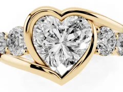 Heart Cut Diamond Bezel Bypass Ring Set in Yellow gold with Round Accents