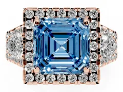Fancy Blue Asscher Cut Diamond Halo Split Shank Ring Set in Rose gold with Round Accent Stones and Prong Setting