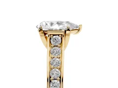Pear Cut Diamond Solitaire Pavé Engagement Ring Set in Yellow gold with Prong Setting