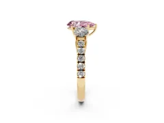 Fancy Pink Pear Cut Diamond Three-Stone Ring Set in Yellow gold with Round Side Stones and Delicate Pavé Band