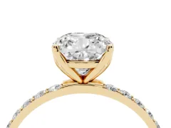 Cushion Cut Diamond Solitaire Engagement Ring Set in Yellow gold with Round Pavé Band and Prong Setting