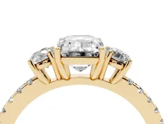Emerald Cut Diamond Three-Stone Ring Set in Yellow gold with Pavé Band and Graduated Sides