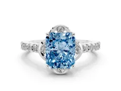 Fancy Blue Radiant Cut Diamond Solitaire Ring Set in White gold with Pavé Band and Floral Prong Setting