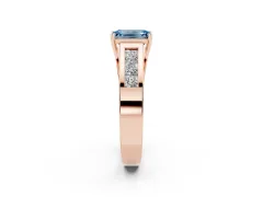 Fancy Blue Emerald Cut Diamond Solitaire Ring Set in Rose gold with Channel-Set Accent Stones and Prong Setting