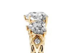 Heart Cut Diamond Three-Stone Ring Set in Yellow gold with Braided Band