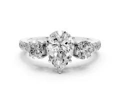 Pear Cut Diamond Three-Stone Ring Set in Platinum with Round Side Stones and Delicate Pavé Band