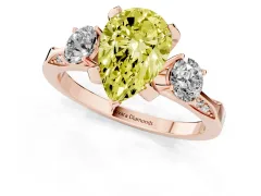 Fancy Yellow Pear Cut Diamond Three-Stone Ring Set in Rose gold with Pavé Band and Smaller Side Stones