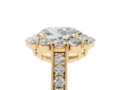 Oval Cut Diamond Halo Pavé Engagement Ring Set in Yellow gold with Milgrain Detailing