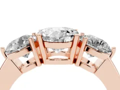 Round Cut Diamond Three-Stone Ring Set in Rose gold with Prong Setting and Plain Band