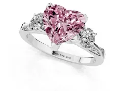 Fancy Pink Heart Cut Diamond Three-Stone Ring Set in White gold with Pavé Band and Smaller Side Stones