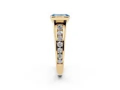 Fancy Blue Emerald Cut Diamond Bezel-Set Solitaire Ring Set in Yellow gold with Channel-Set Band