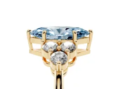Fancy Blue Marquise Cut Diamond Solitaire Ring Set in Yellow gold with Cluster Accents on Each Side