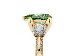 Fancy Green Pear Cut Diamond Three-Stone Ring Set in Yellow gold with Pavé Band and Smaller Side Stones