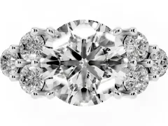 Round Cut Diamond Solitaire Ring Set in Silver with Cluster Accents on Each Side