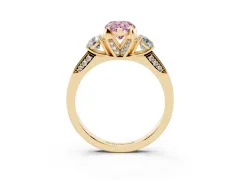 Fancy Pink Pear Cut Diamond Three-Stone Ring Set in Yellow gold with Pavé Band and Smaller Side Stones
