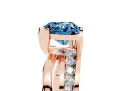 Fancy Blue Heart Cut Diamond Solitaire Ring Set in Rose gold with Channel Set Split Shank and Tension Prongs