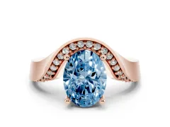 Fancy Blue Oval Cut Diamond Solitaire Engagement Ring Set in Rose gold with Pavé Shoulders