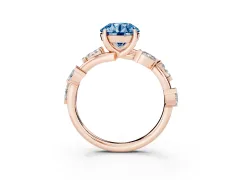 Fancy Blue Round Cut Diamond Solitaire Ring Set in Rose gold with Twisted Marquise Accent Band