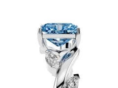 Fancy Blue Radiant Cut Diamond Solitaire Ring Set in Platinum with Twisted Marquise Accent Band