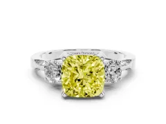 Fancy Yellow Cushion Cut Diamond Three-Stone Ring Set in Silver with Pavé Band and Smaller Side Stones