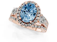 Fancy Blue Oval Cut Diamond Halo Split Shank Ring Set in Rose gold with Round Accent Stones and Prong Setting