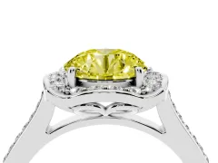Fancy Yellow Round Cut Diamond Halo Ring Set in White gold with Pavé-Lined Shoulders and Prong Setting