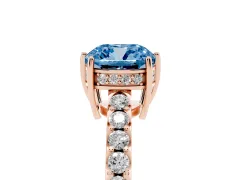 Fancy Blue Cushion Cut Diamond Solitaire Engagement Ring Set in Rose gold with Pavé Band and Prong Setting