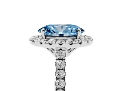 Fancy Blue Oval Cut Diamond Pavé Halo Engagement Ring Set in White gold with Pavé Band and Prong Setting