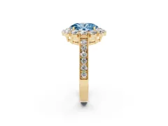 Fancy Blue Oval Cut Diamond Halo Pavé Engagement Ring Set in Yellow gold with Milgrain Detailing