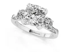 Cushion Cut Diamond Three-Stone Ring Set in White gold with Pavé Band and Smaller Side Stones