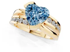Fancy Blue Heart Cut Diamond Solitaire Ring Set in Yellow gold with Channel Set Split Shank and Tension Prongs