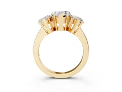 Heart Cut Diamond Three-Stone Ring Set in Yellow gold with Channel-Set Band and Prong Settings