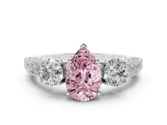 Fancy Pink Pear Cut Diamond Three-Stone Ring Set in White gold with Round Side Stones and Pavé Band