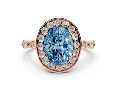 Fancy Blue Oval Cut Diamond Halo Engagement Ring Set in Rose gold with Twisted Band and Prong Setting