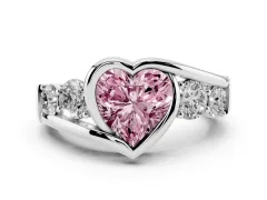 Fancy Pink Heart Cut Diamond Bezel Bypass Ring Set in Platinum with Round Accents
