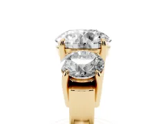 Round Cut Diamond Three-Stone Ring Set in Yellow gold with Round Accent Stones and Plain Band