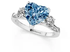 Fancy Blue Heart Cut Diamond Three-Stone Ring Set in Platinum with Pavé Band and Smaller Side Stones