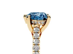 Fancy Blue Heart Cut Diamond Solitaire Ring Set in Yellow gold with Brilliant Pavé Band and Prong Setting