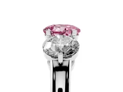 Fancy Pink Round Cut Diamond Three-Stone Ring Set in Platinum with Prong Setting and Plain Band