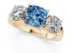 Fancy Blue Cushion Cut Diamond Three-Stone Ring Set in Yellow gold with Round Side Stones and Classic Band