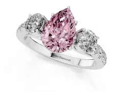 Fancy Pink Pear Cut Diamond Three-Stone Ring Set in Silver with Round Side Stones and Delicate Pavé Band