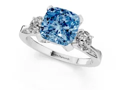 Fancy Blue Cushion Cut Diamond Three-Stone Ring Set in Platinum with Pavé Band and Smaller Side Stones