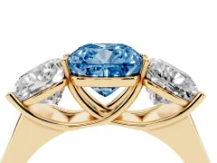 Fancy Blue Cushion Cut Diamond Three-Stone Ring Set in Yellow gold with Plain Polished Band